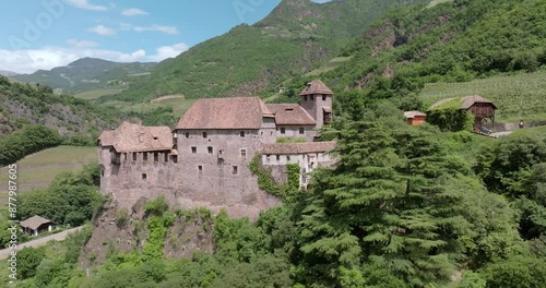 Wallpaper Mural Bolzano Castle from Above - Stunning Historical Landmark in the Alps of Italy, Nestled Among Forested Ridges and Peaks. High quality 4k footage Torontodigital.ca