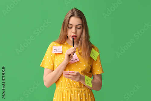 Thoughtful young woman with...