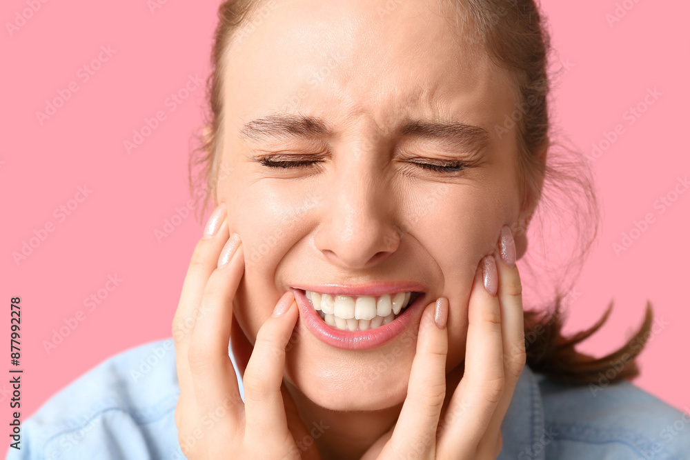 Beautiful young woman suffering from toothache on pink background, closeup Beautiful young woman suffering from toothache on pink background, closeup