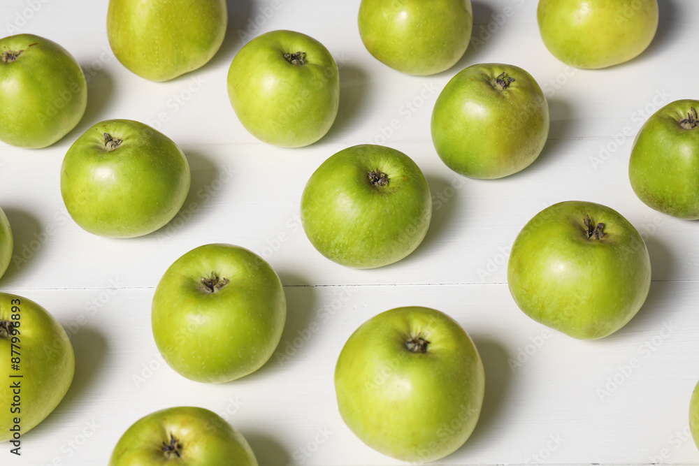 Fresh ripe green apples on white wooden table Fresh ripe green apples on white wooden table
