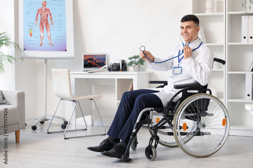 Young male doctor in wheelchair with stethoscope at hospital Young male doctor in wheelchair with stethoscope at hospital