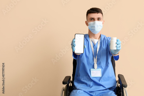 Young male doctor in wheelc...