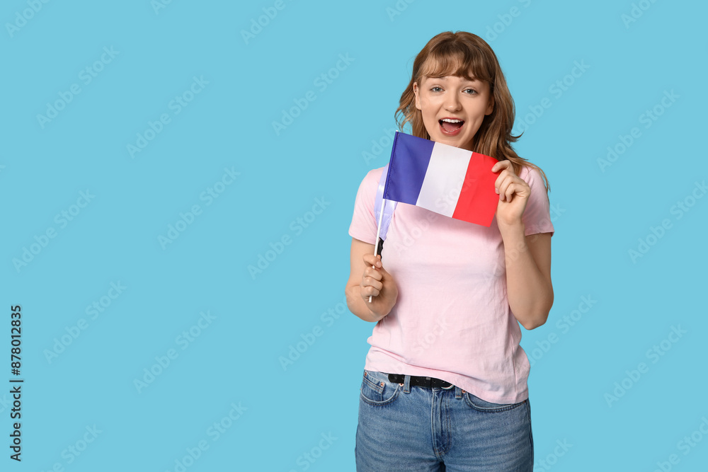 Female student with French flag on blue background Female student with French flag on blue background