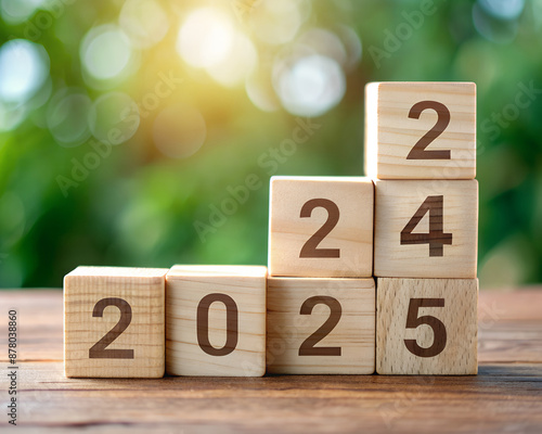 Starting new year 2025. Flipping of 2023 to 2025 on wooden cube blocks. Beginning and start of the new year 2025. Preparation for new year ,life, business, plan, goals, target and strategy concept.