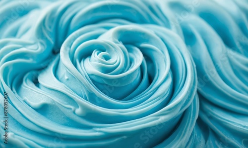 Textured background of blue frosting with swirl pattern