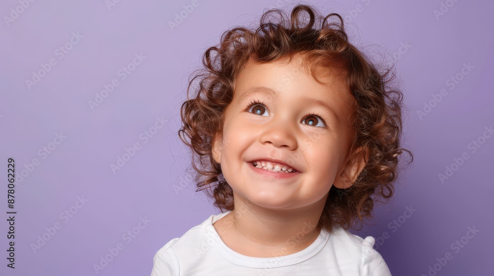 A delightful young child in high resolution, standing against a solid lavender background. The bright, natural lighting highlights the child's cheerful expression and the vibrant colors, creating a A delightful young child in high resolution, standing against a solid lavender background. The bright, natural lighting highlights the child's cheerful expression and the vibrant colors, creating a