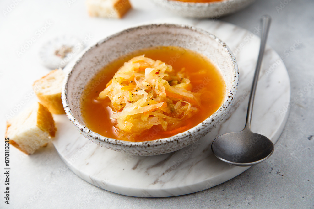 Homemade sauerkraut soup served with bread Homemade sauerkraut soup served with bread