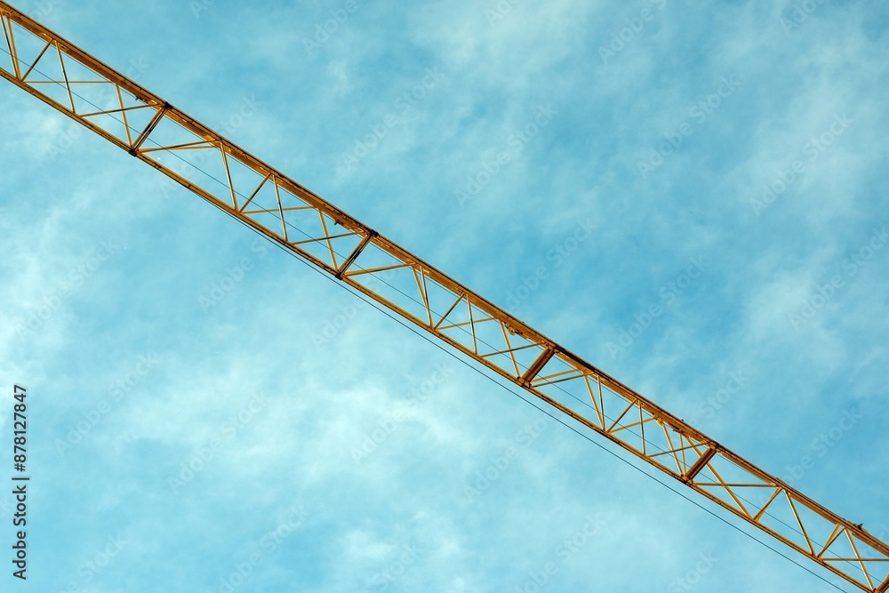 Construction site in Munich City crane boom against blue sky Construction site in Munich City crane boom against blue sky