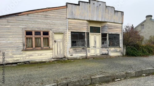 Run down dilapidated building on main street of small town Ophir in Central Otago photo