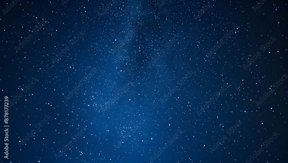 Naklejka premium Starry sky at night, dark blue background, starry field, glowing stars, blurred stars in the lower left corner of the screen, minimalism, wide angle