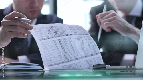 Closeup businessman sign contract or legal document with pen in his hand during corporate meeting for business deal