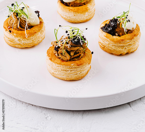 Gourmet vol-au-vent pastries on white plate photo