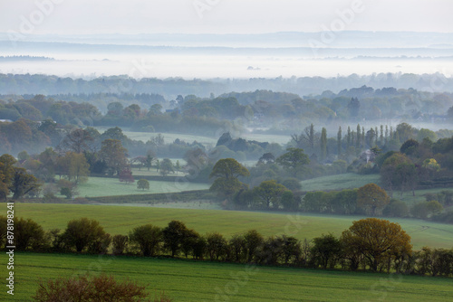 Misty landscape looking towards village of Highclere from the Wayfarer's Walk at Three Legged Cross, Highclere, Hampshire, England, United Kingdom, Europe