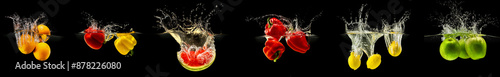 Group of falling fruits and vegetables in water with splash on black background