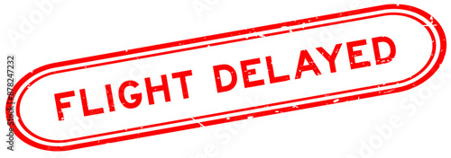 Grunge red flight delayed word rubber seal stamp on white background