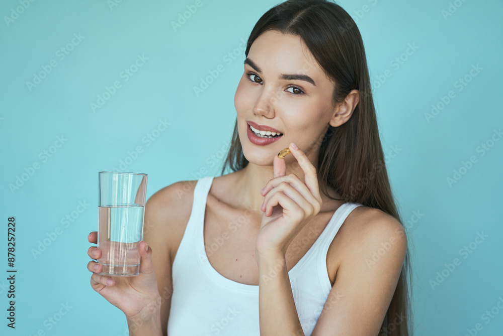 Woman Holding Vitamin Pill And Glass Of Water, Promoting Health And Wellness Concepts Woman Holding Vitamin Pill And Glass Of Water, Promoting Health And Wellness Concepts