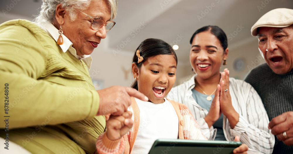 Obraz premium Tablet, family and excited child with success, winning or clapping for good exam results. Kid, grandparents or mother on technology for school achievement, prize or celebrate with generations in home