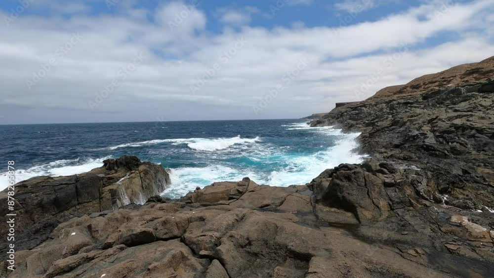 resources of the raging sea breaking on a volcanic rock resources of the raging sea breaking on a volcanic rock