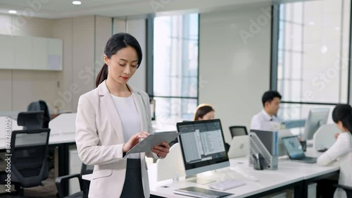 Successful businesswoman using digital tablet in office