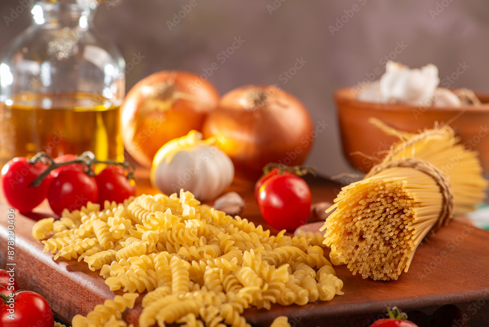 Pasta, table with pasta, ingredients and utensils, selective focus. Pasta, table with pasta, ingredients and utensils, selective focus.