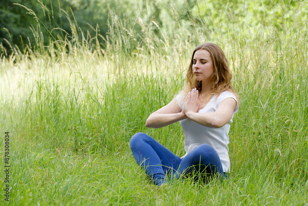 Woman meditating with eyes closed, doing breathing exercises, relaxing body and mind. Mental health and stress-free meditation. Woman meditating with eyes closed, doing breathing exercises, relaxing body and mind. Mental health and stress-free meditation.