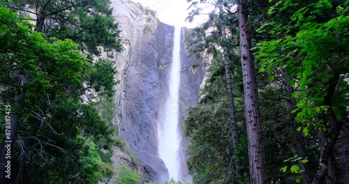 Bridalveil Fall waterfall and green trees in Yosemite National Park