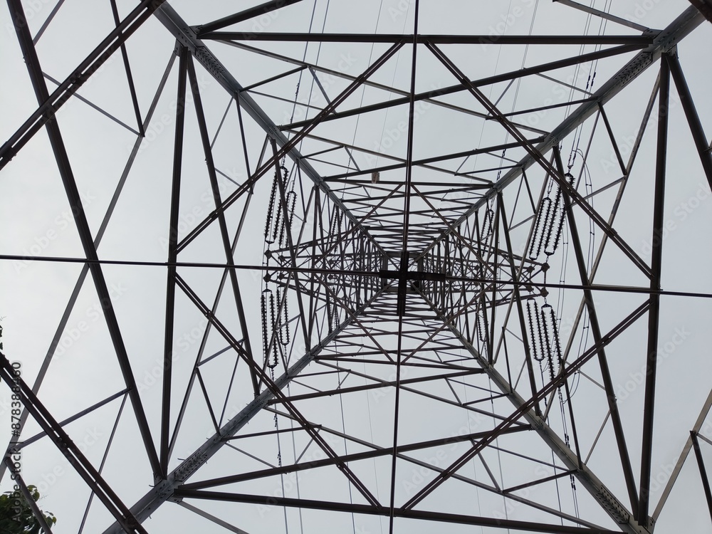 A power line tower forming a cross when viewed from below. A power line tower forming a cross when viewed from below.