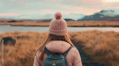 A Woman Gazes at the Majestic Icelandic Landscape, Taking in the Breathtaking Beauty of Nature Female Observing the Wonders of Iceland, Female sland Watching, Icelandic Marvel photo