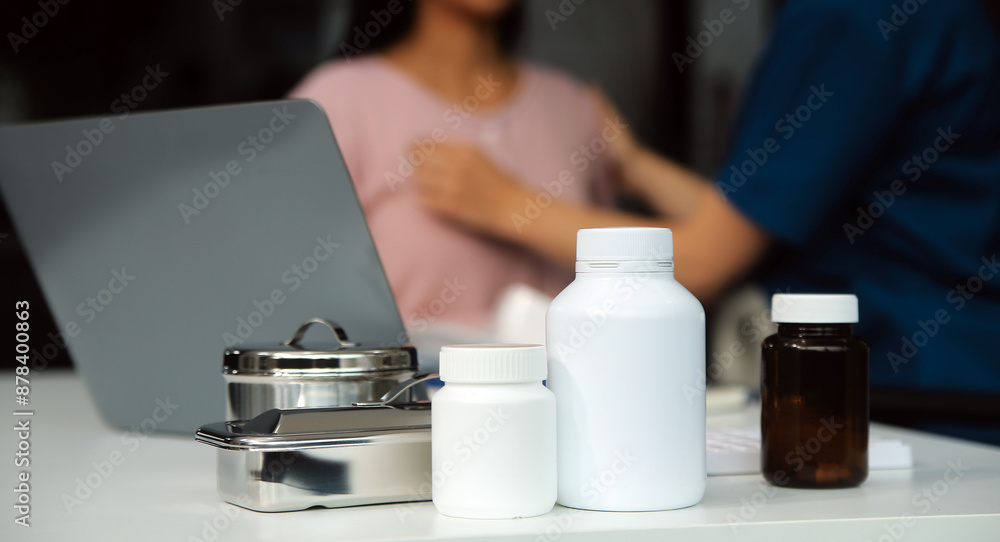 Doctor and patient discussing something while sitting at the table . Medicine and health care concept. Doctor and patient