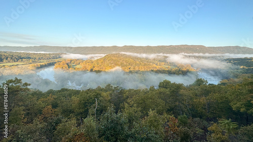 Morning in the Blue Ridge Mountains, fog and mist over the Shenandoah River on a beautiful autumn day.