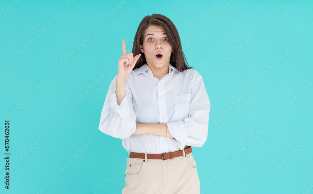Image of excited young lady standing isolated blue background. Looking at camera have an idea. Image of excited young lady standing isolated blue background. Looking at camera have an idea.