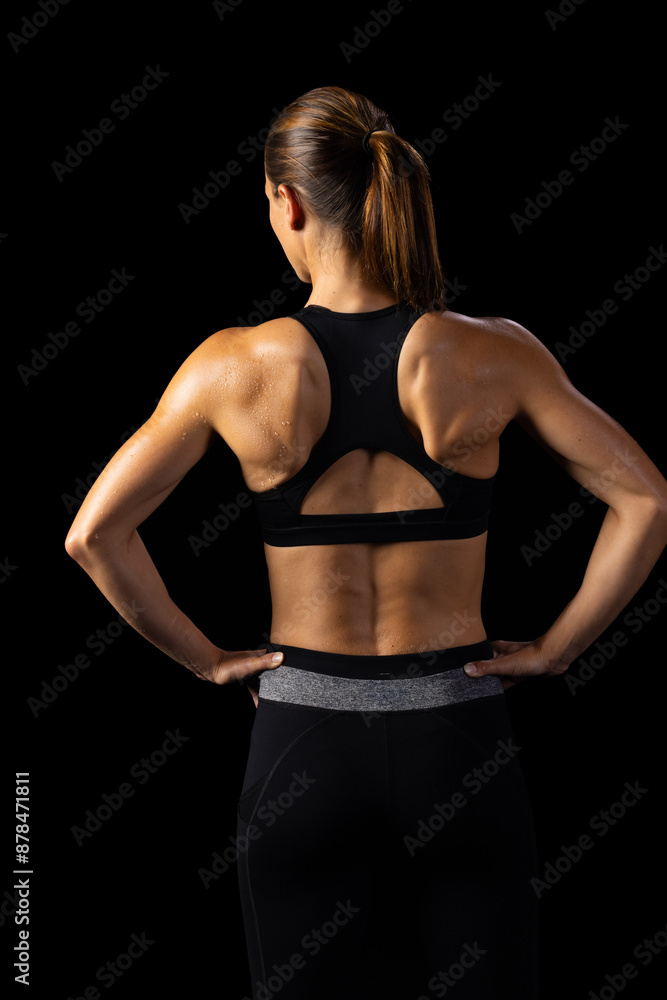 Athlete displays toned back, highlighting strength and health dedication. Athlete displays toned back, highlighting strength and health dedication.