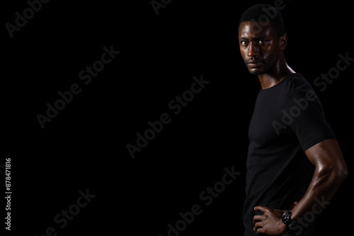 Tableau sur toile African American man poses confidently against a dark background on black backgr