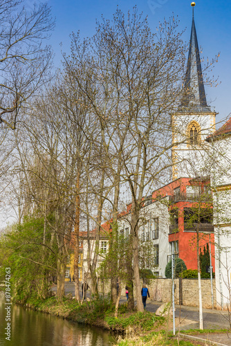 Obraz na płótnie Tower of the historic Nikolai church at the park in Erfurt, Germany w salonie