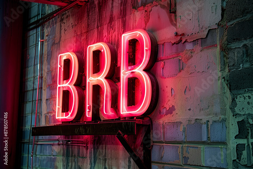 Illuminated BRB neon sign. Be right back abbreviated neon sign. 