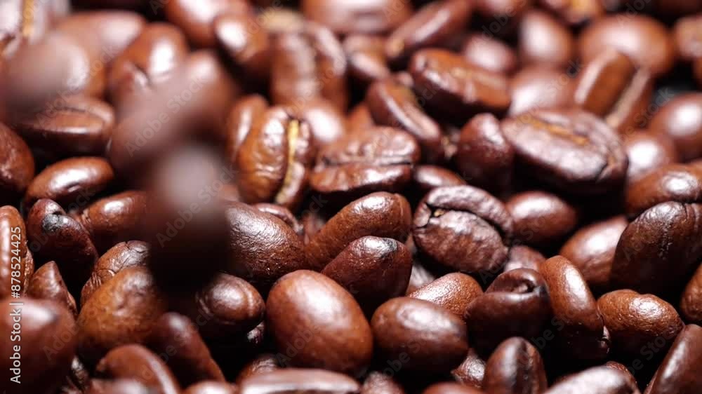 Coffee beans slow motion falling. High quality super slow motion coffee beans falling on a black table Coffee beans slow motion falling. High quality super slow motion coffee beans falling on a black table