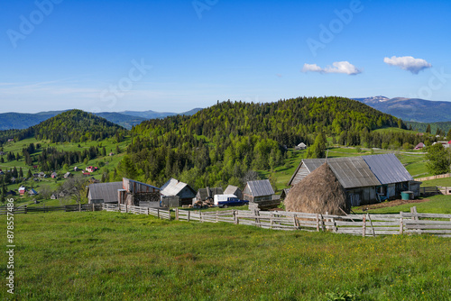 Romanian rural landscape in an isolated mountainous rural area in Apuseni Mountains, Garda de Sus, Transylvania, Romania photo