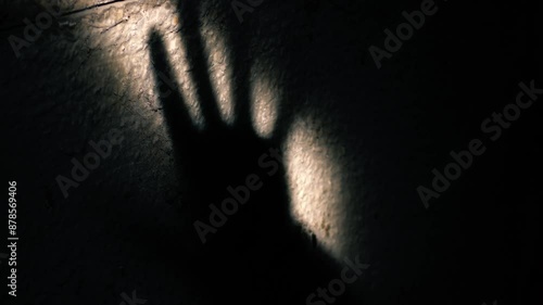 Shadow of hand on wall 