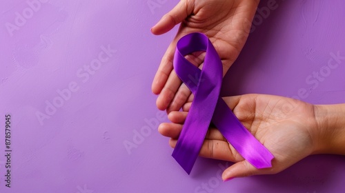 Purple Awareness Ribbon Held in Hands