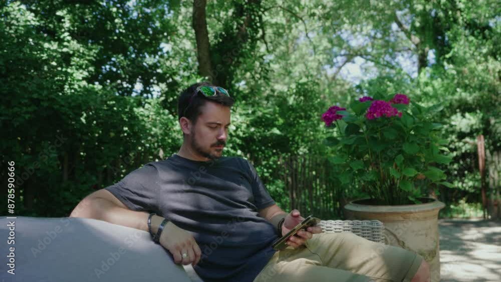 Man on Phone in Garden