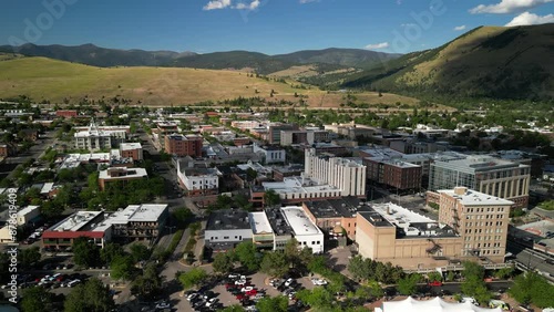 Missoula Montana aerial of downtown buildings and mountains in summer