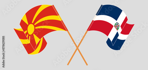 Crossed and waving flags of North Macedonia and Dominican Republic