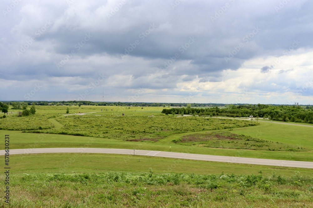 The green country field on a cloudy spring day. The green country field on a cloudy spring day.