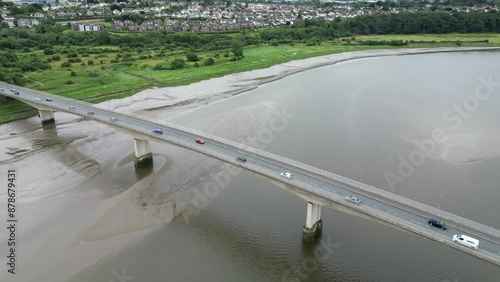 Barnstaple, Devon, England: DRONE VIEWS: The A361 bridge spanning the River Taw. The A361 bridge crosses the River Taw at the river's lowest point and is a major local transport artery (Clip 2). photo