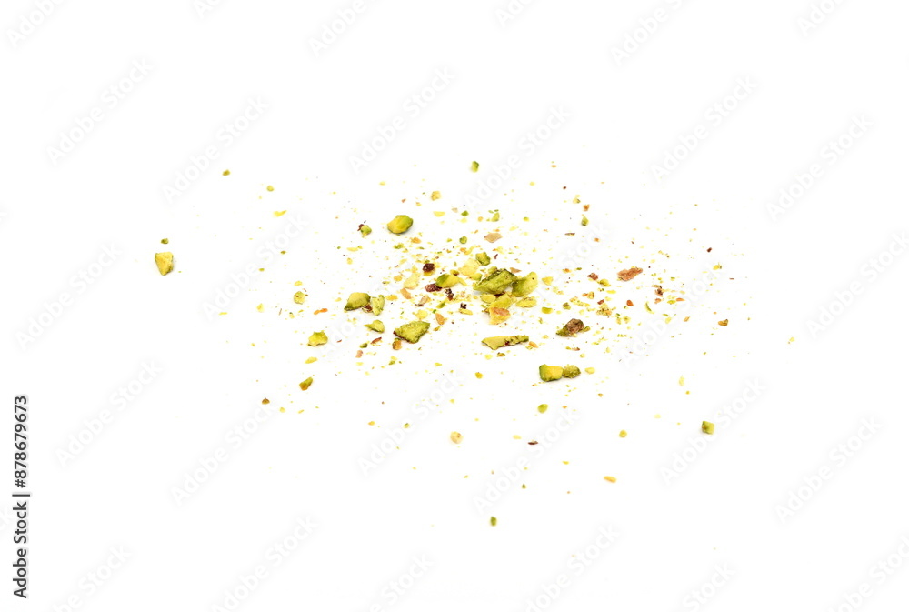 Scattered pistachio nut pieces isolated. Break chopped pistachios pile, fried baked diced pistache on white background Scattered pistachio nut pieces isolated. Break chopped pistachios pile, fried baked diced pistache on white background