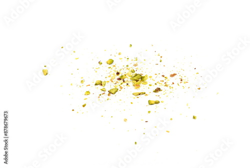 Scattered pistachio nut pieces isolated. Break chopped pistachios pile, fried baked diced pistache on white background 