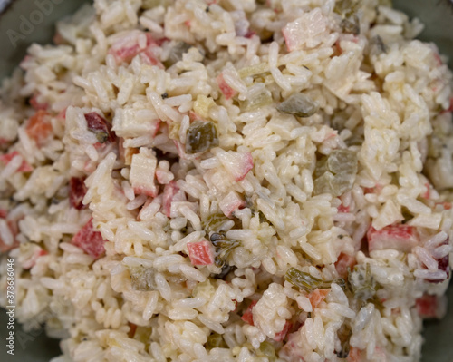 Top view of a rice and pickles salad with light mayonnaise dressing