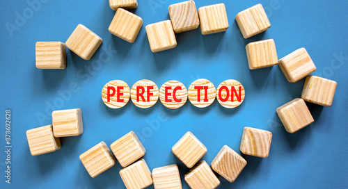 Perfection symbol. Concept word Perfection on beautiful wooden circles. Beautiful blue background. Beautiful wooden cubes. Business perfection concept. Copy space.