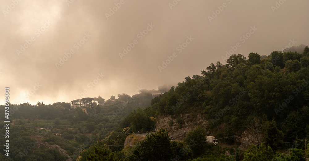 Misty Hills of Sorrento - A captivating scene of the lush, fog-covered hills in Sorrento, Campania, Italy.