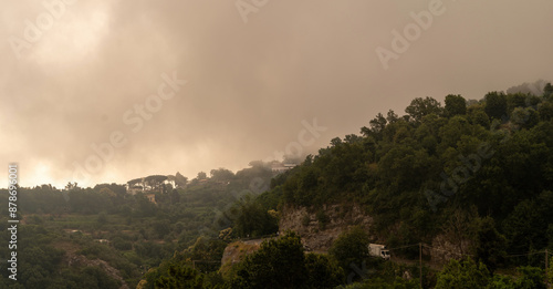 Obraz na płótnie Misty Hills of Sorrento - A captivating scene of the lush, fog-covered hills in Sorrento, Campania, Italy. w salonie